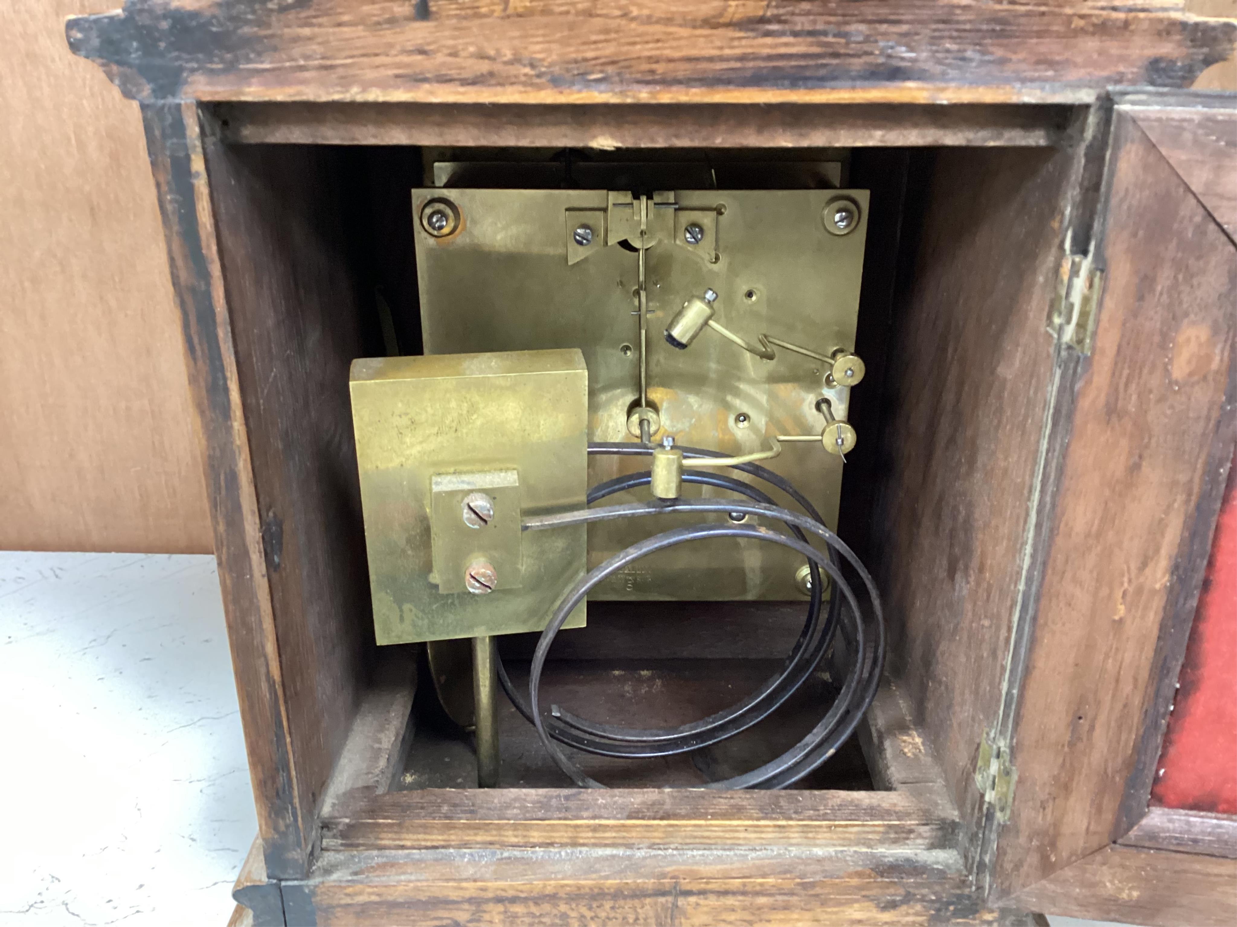 A late 19th century W&H oak cased mantel clock, chiming and striking on two coiled gongs, 27cm high. Condition - fair to good, missing the handle to the top